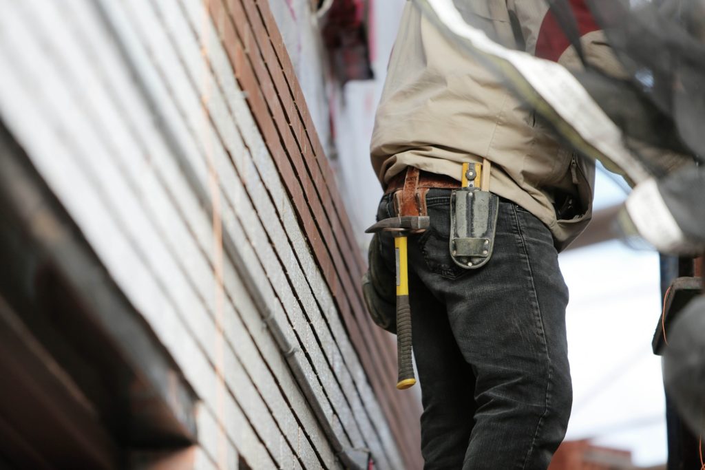 construction worker with a hammer on his belt
