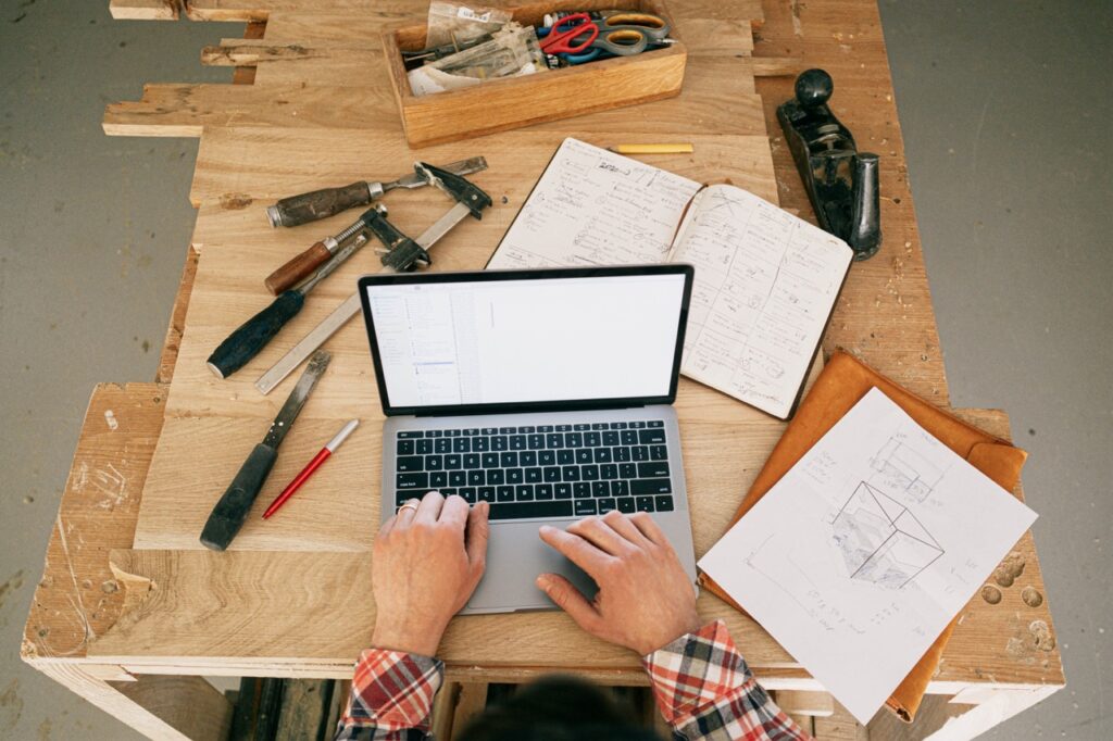 Man working on a laptop for a construction project
