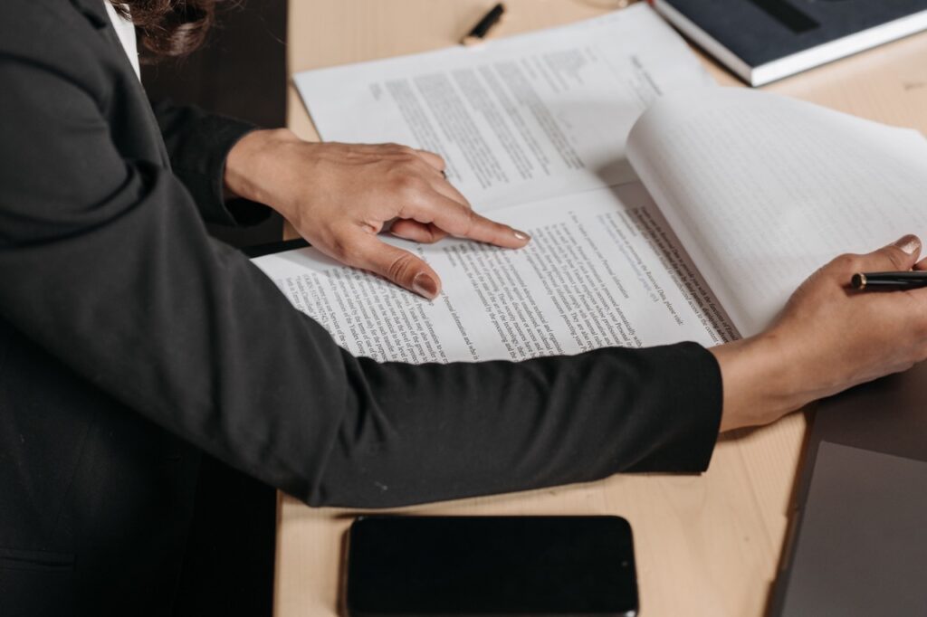 A woman reading the fine print of legal contracts.